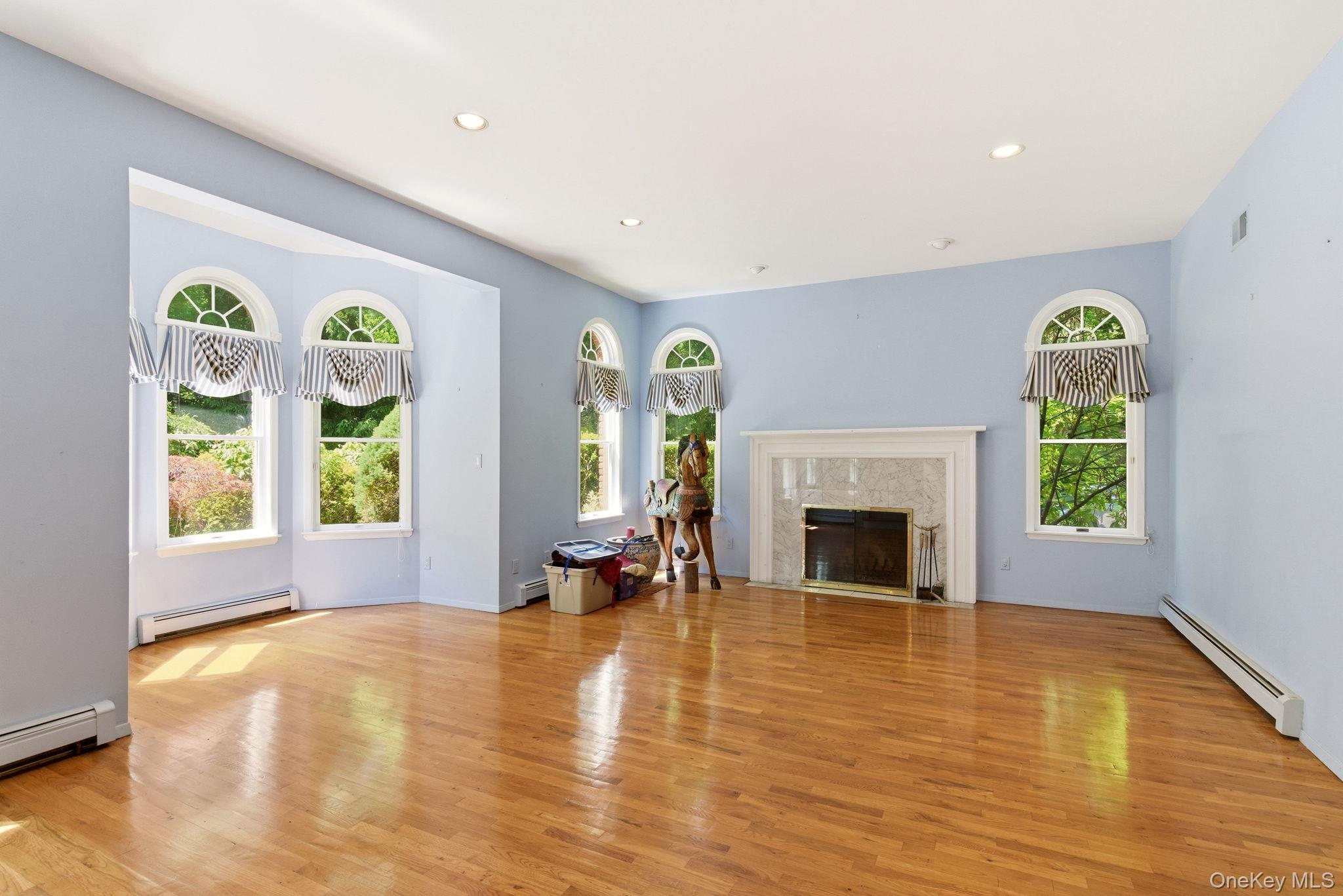380 Duck Pond Road Locust Valley, NY 11560 - Photo 12 of 41 Living room with hardwood floors, high ceilings and fireplace