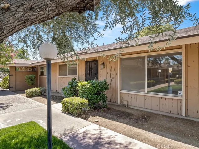 a front view of a house with yard and garage