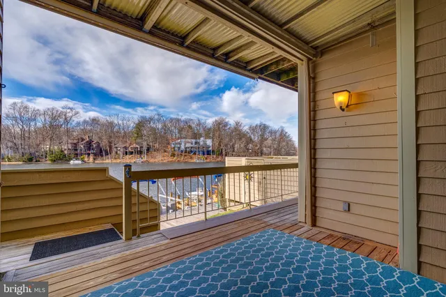 a view of a balcony with wooden floor
