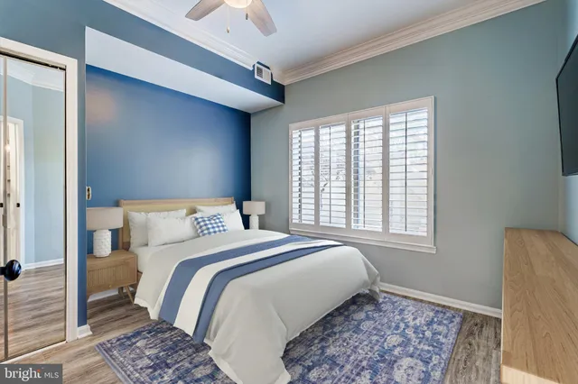 a bedroom with a large bed and a window