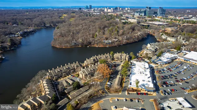 an aerial view of a house with a lake view