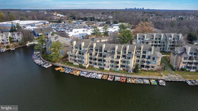 an aerial view of a house with a lake view