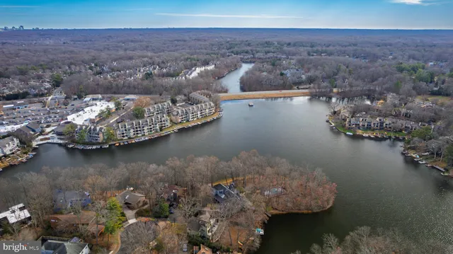 an aerial view of a house with a lake view