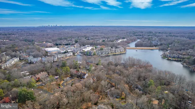 an aerial view of a house with a lake view