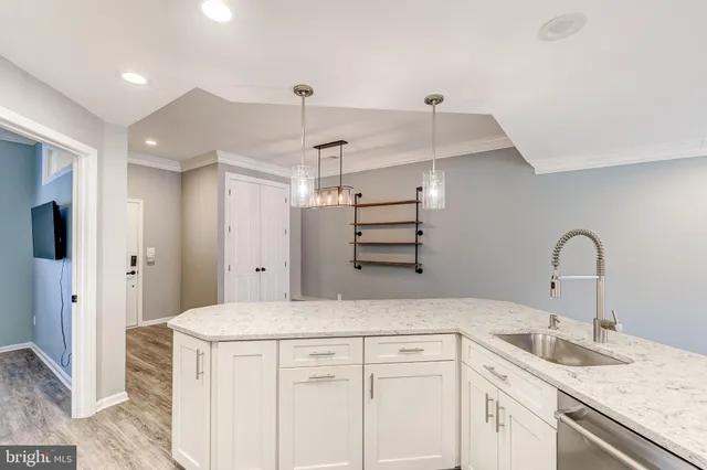 a kitchen with a sink and cabinets