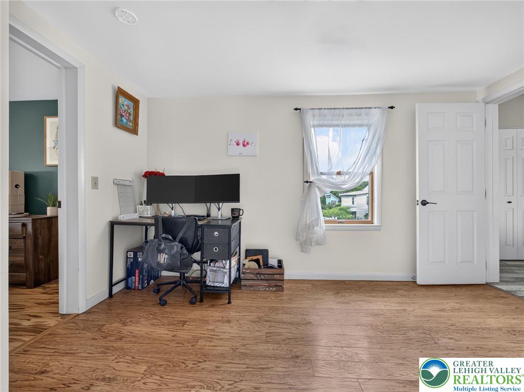 2628 Levans Road Coplay, PA 18037 - Photo 40 of 54 Well-lit room with wood flooring, offering versatile space for living or working.