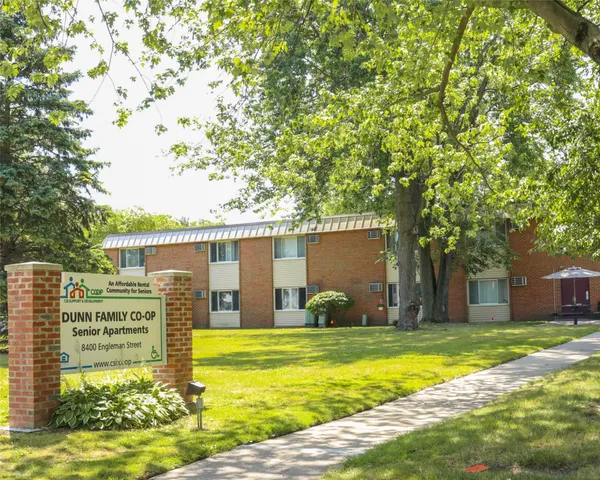 a view of swimming pool with outdoor seating and plants