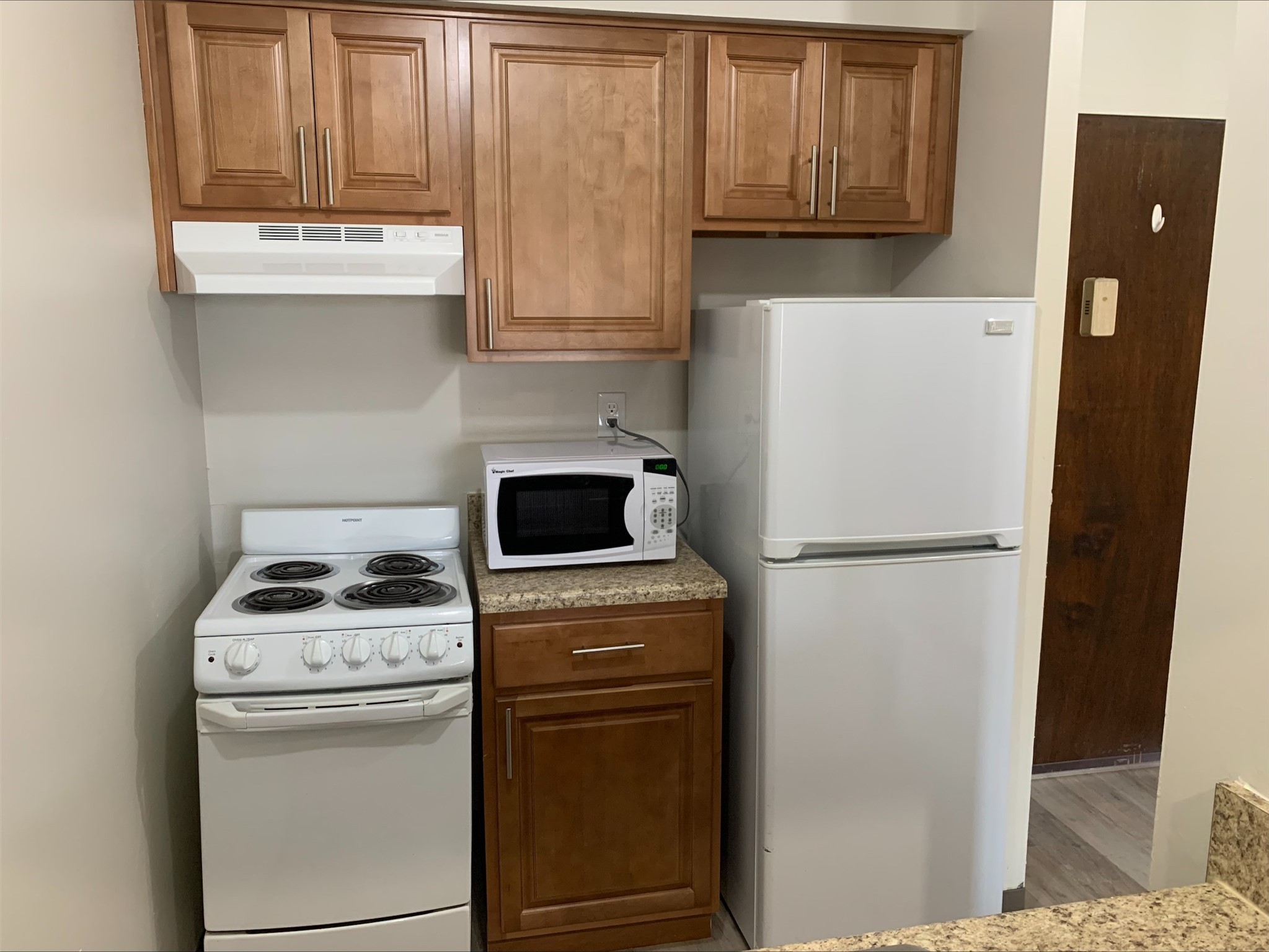 8400 Engleman Street Center Line, MI 48015 - Photo 12 of 16 a white refrigerator freezer and a stove sitting inside of a kitchen