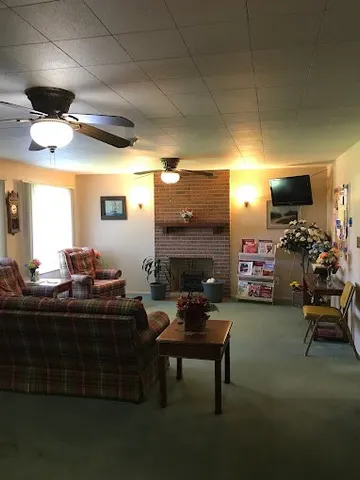 a living room with furniture and a fireplace
