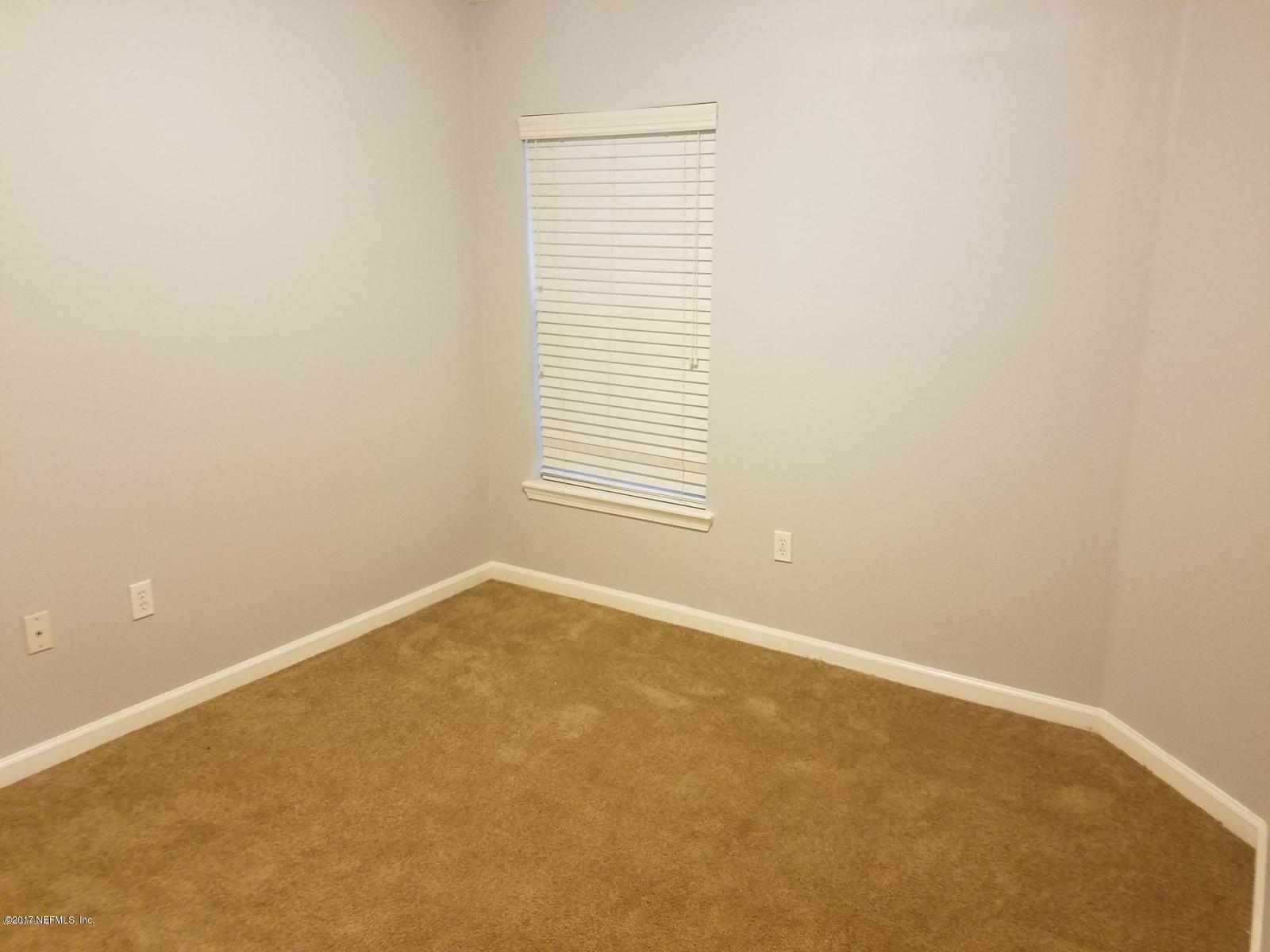 3680 Kirkpatrick Circle, Unit 5 Jacksonville, FL 32210 - Photo 11 of 18 an empty room with a window