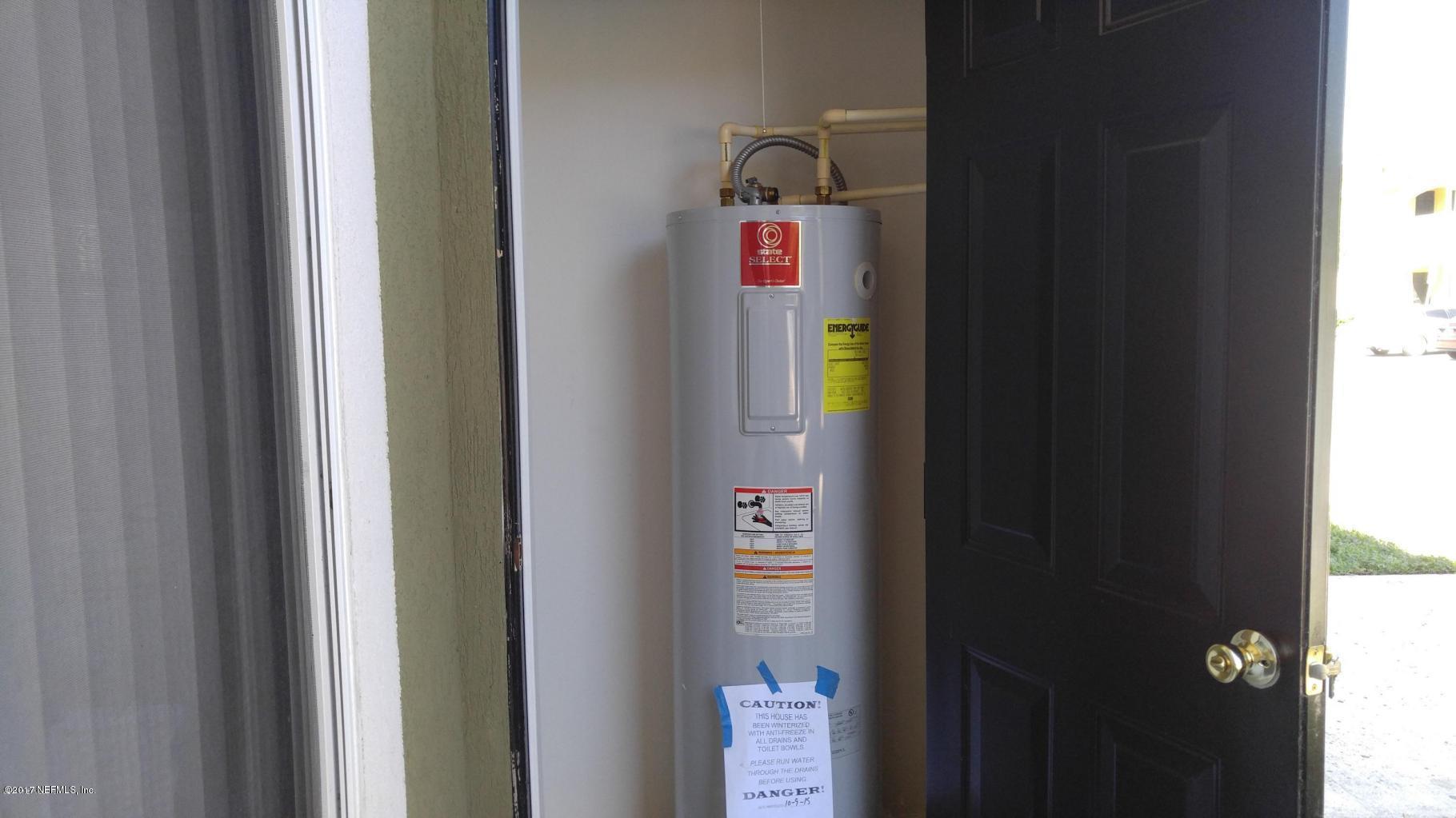 3680 Kirkpatrick Circle, Unit 5 Jacksonville, FL 32210 - Photo 16 of 18 a utility room with dryer and washer