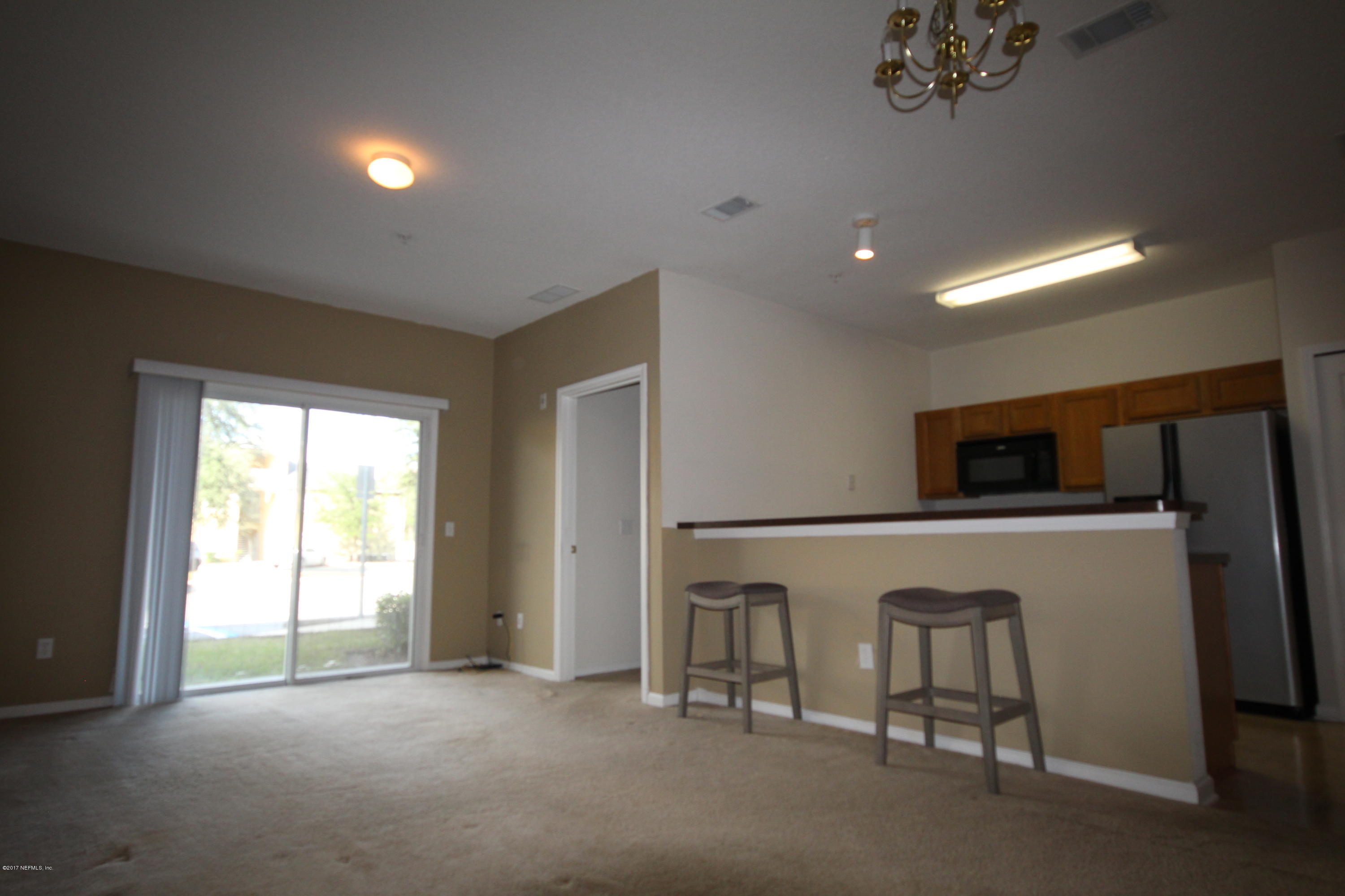 3680 Kirkpatrick Circle, Unit 5 Jacksonville, FL 32210 - Photo 3 of 18 a view of livingroom with furniture and windows