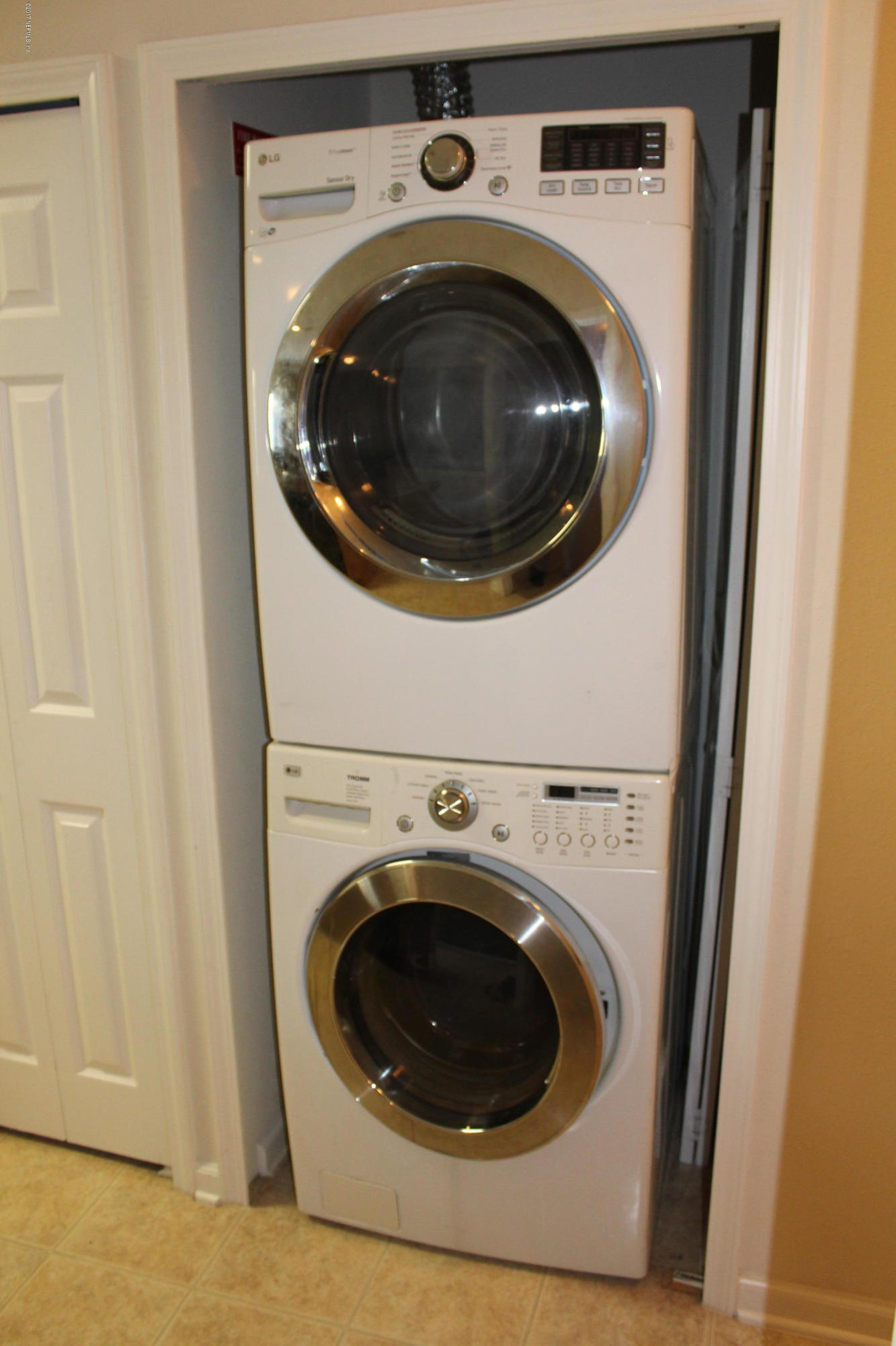 3680 Kirkpatrick Circle, Unit 5 Jacksonville, FL 32210 - Photo 6 of 18 a utility room with dryer and washer