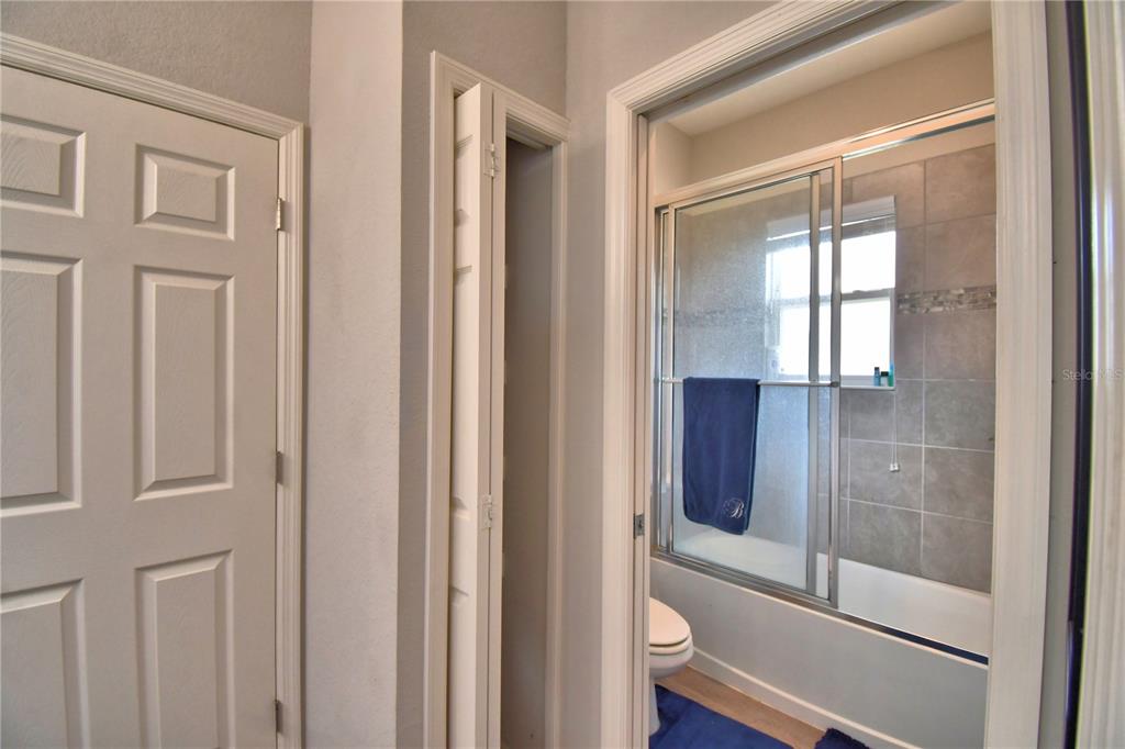 4340 Reding Way Lakeland, FL 33813 - Photo 31 of 63 a bathroom with a glass shower door