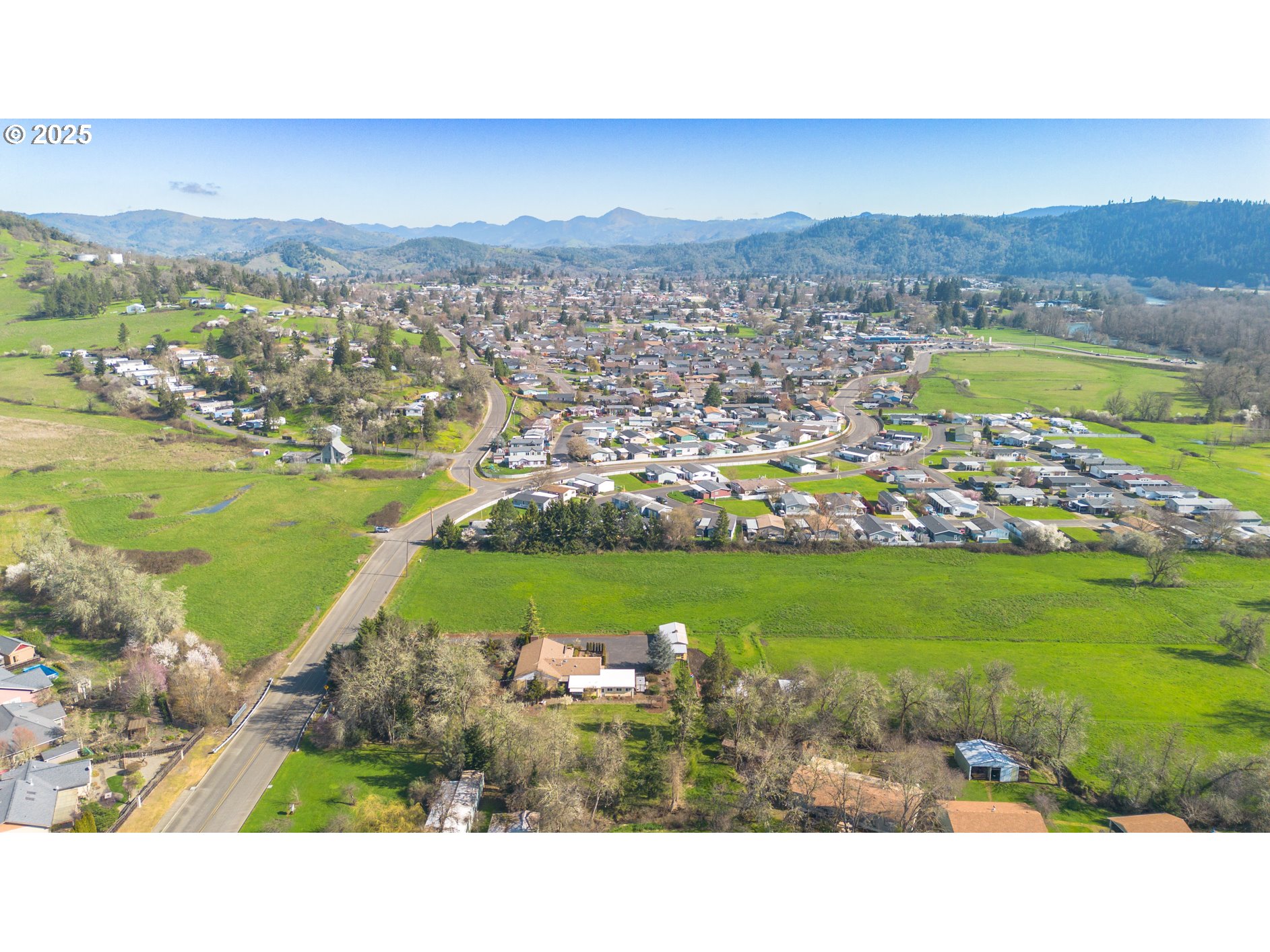 Lookingglass Road Winston, OR 97496 - Photo 3 of 7 a view of a city with a lake view
