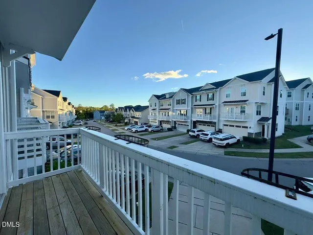 a large kitchen with kitchen island a sink table and chairs