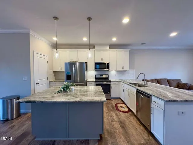 a room with lots of chairs and mirrors