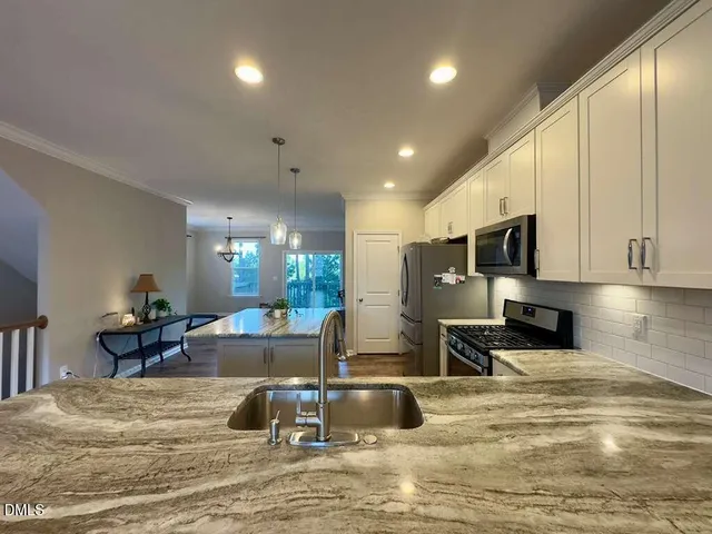 a view of balcony with wooden floor and fence