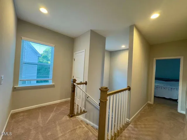 a view of a hallway with closet area