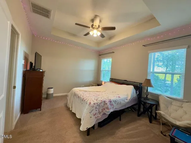 a bathroom with a double vanity sink mirror and shower