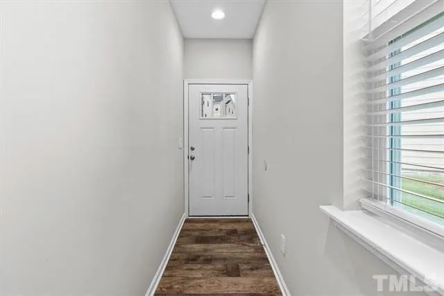 a view of a hallway with windows