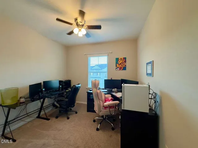 a view of a house with backyard and porch