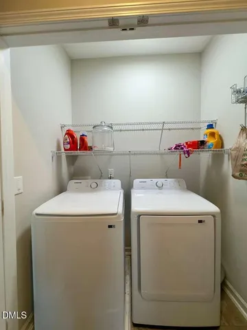a view of a patio with table and chairs and potted plants