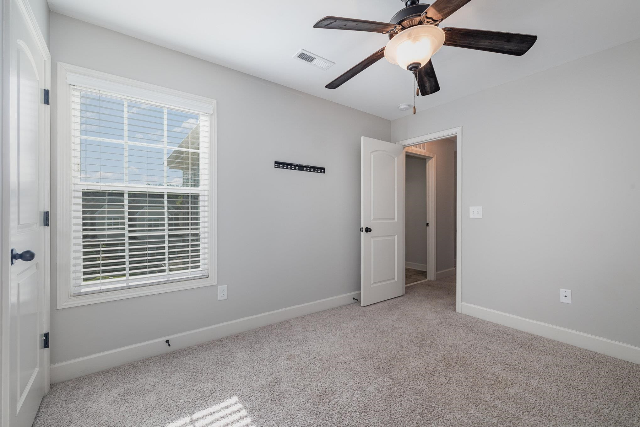 135 Pine Hawk Drive Spring Lake, NC 28390 - Photo 18 of 41 a view of an empty room with a window
