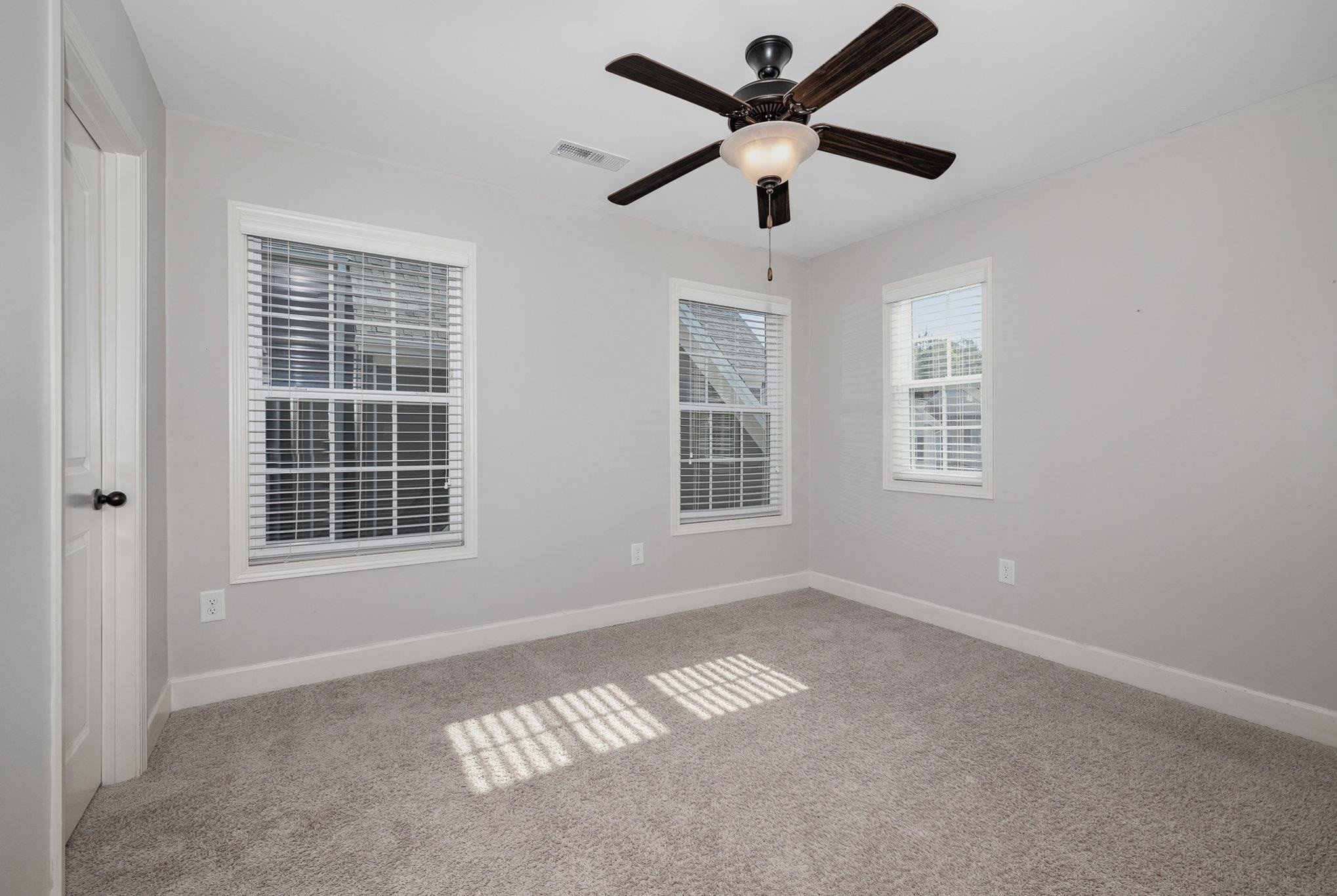 135 Pine Hawk Drive Spring Lake, NC 28390 - Photo 19 of 41 an empty room with windows and fan