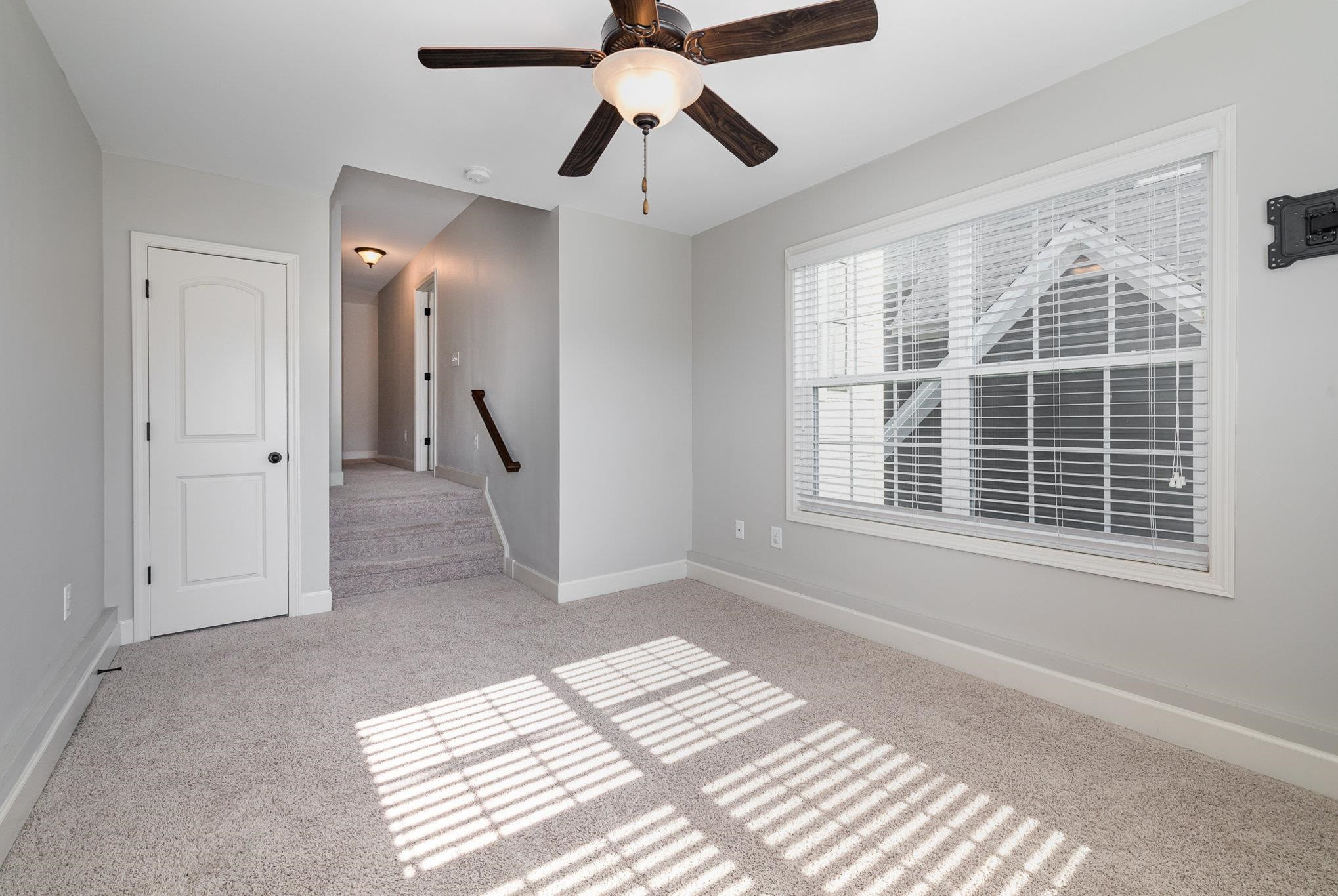 135 Pine Hawk Drive Spring Lake, NC 28390 - Photo 22 of 41 a view of empty room with wooden floor and fan