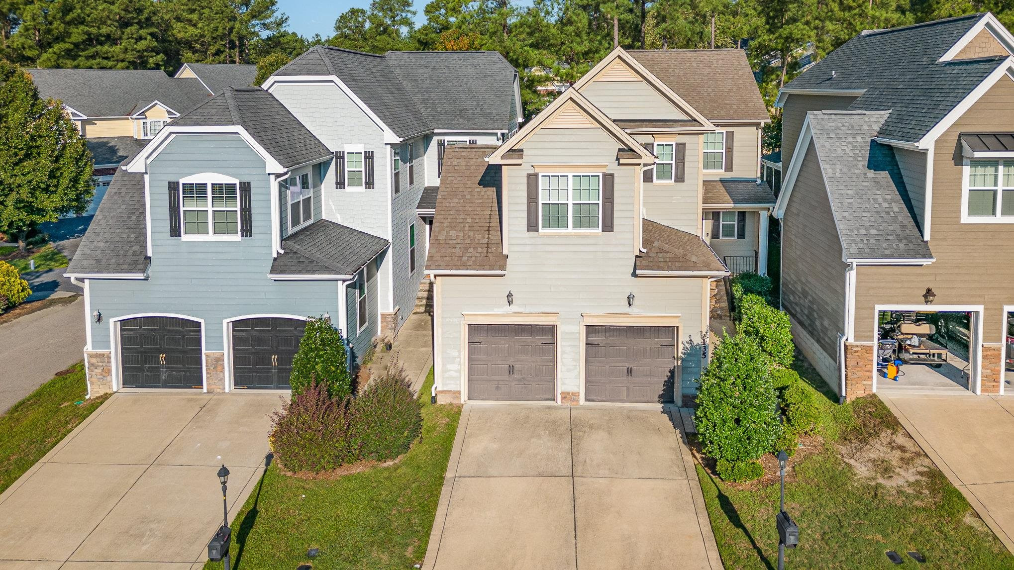 135 Pine Hawk Drive Spring Lake, NC 28390 - Photo 30 of 41 a front view of a house with a yard and garage