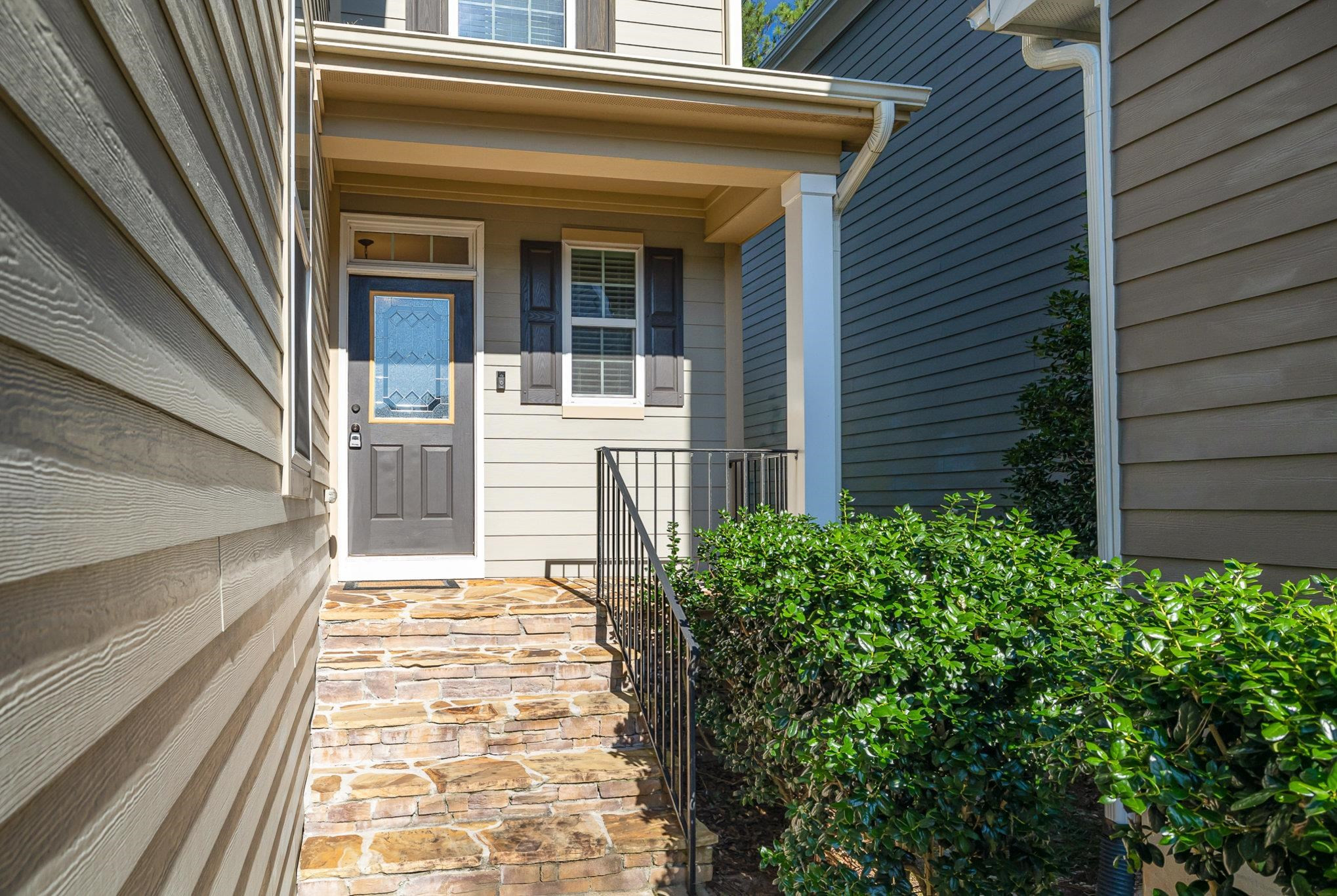 135 Pine Hawk Drive Spring Lake, NC 28390 - Photo 3 of 41 a front view of a house with a garden