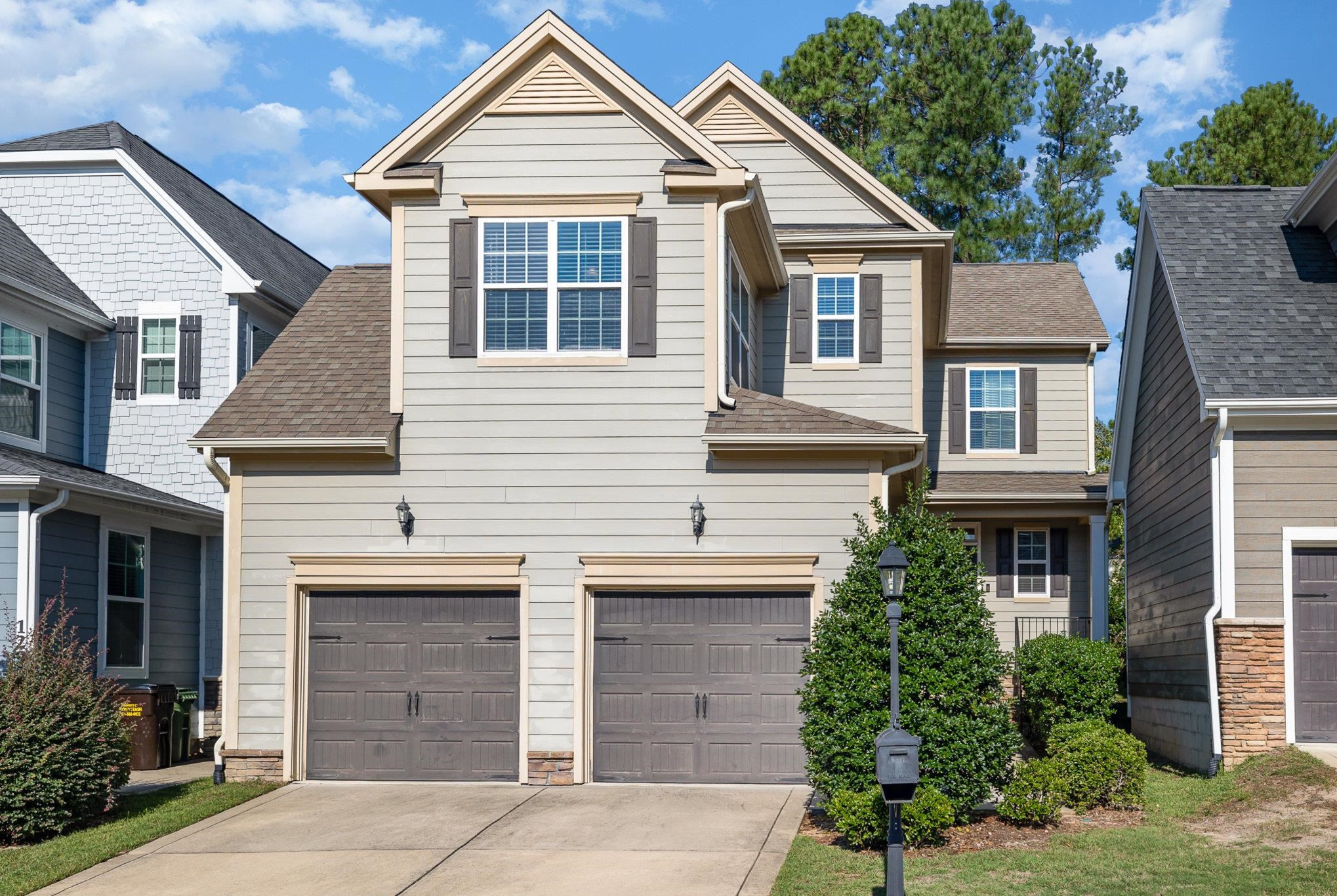 135 Pine Hawk Drive Spring Lake, NC 28390 - Photo 40 of 41 a front view of a house with a yard and garage