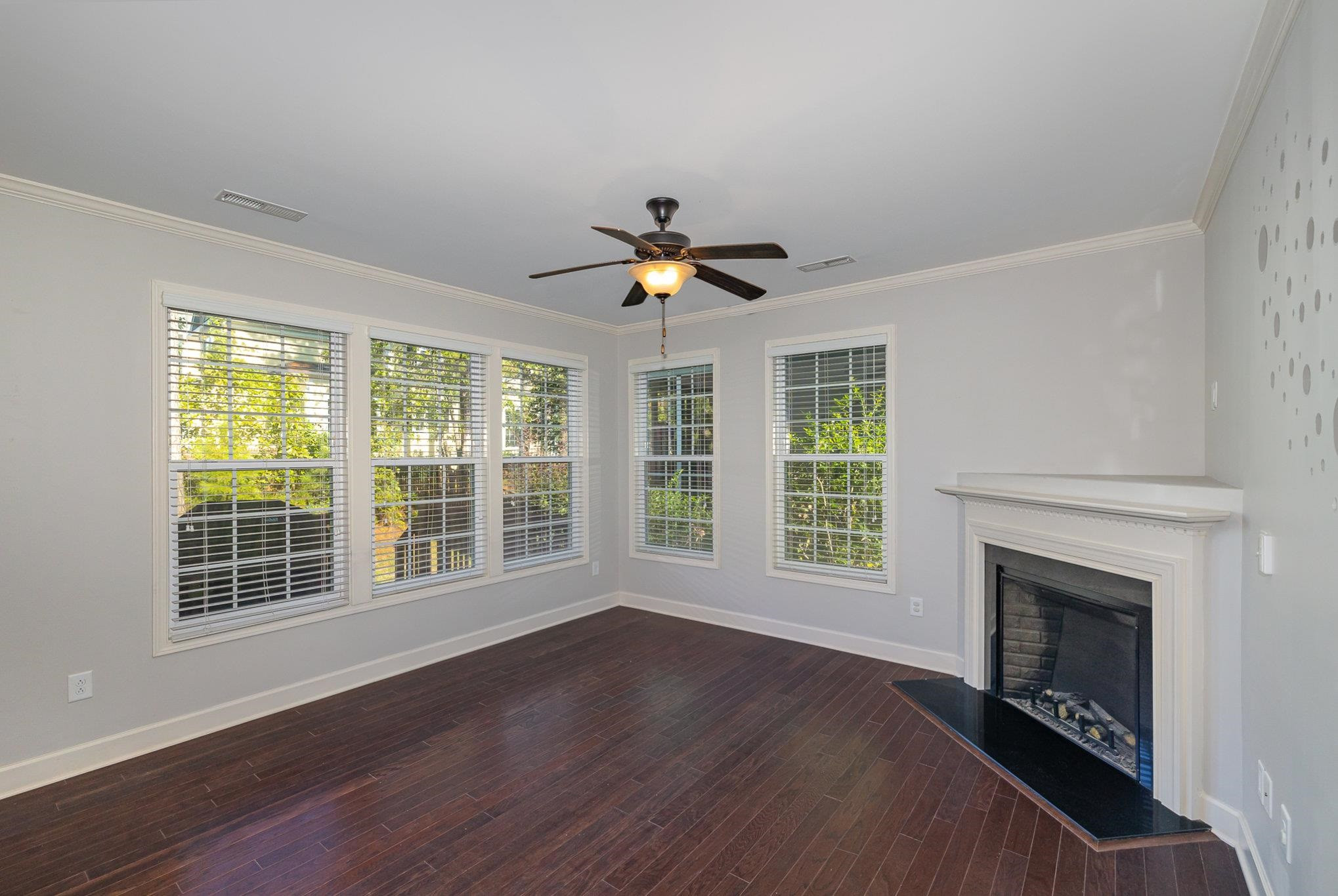 135 Pine Hawk Drive Spring Lake, NC 28390 - Photo 5 of 41 a view of an empty room with wooden floor and a window