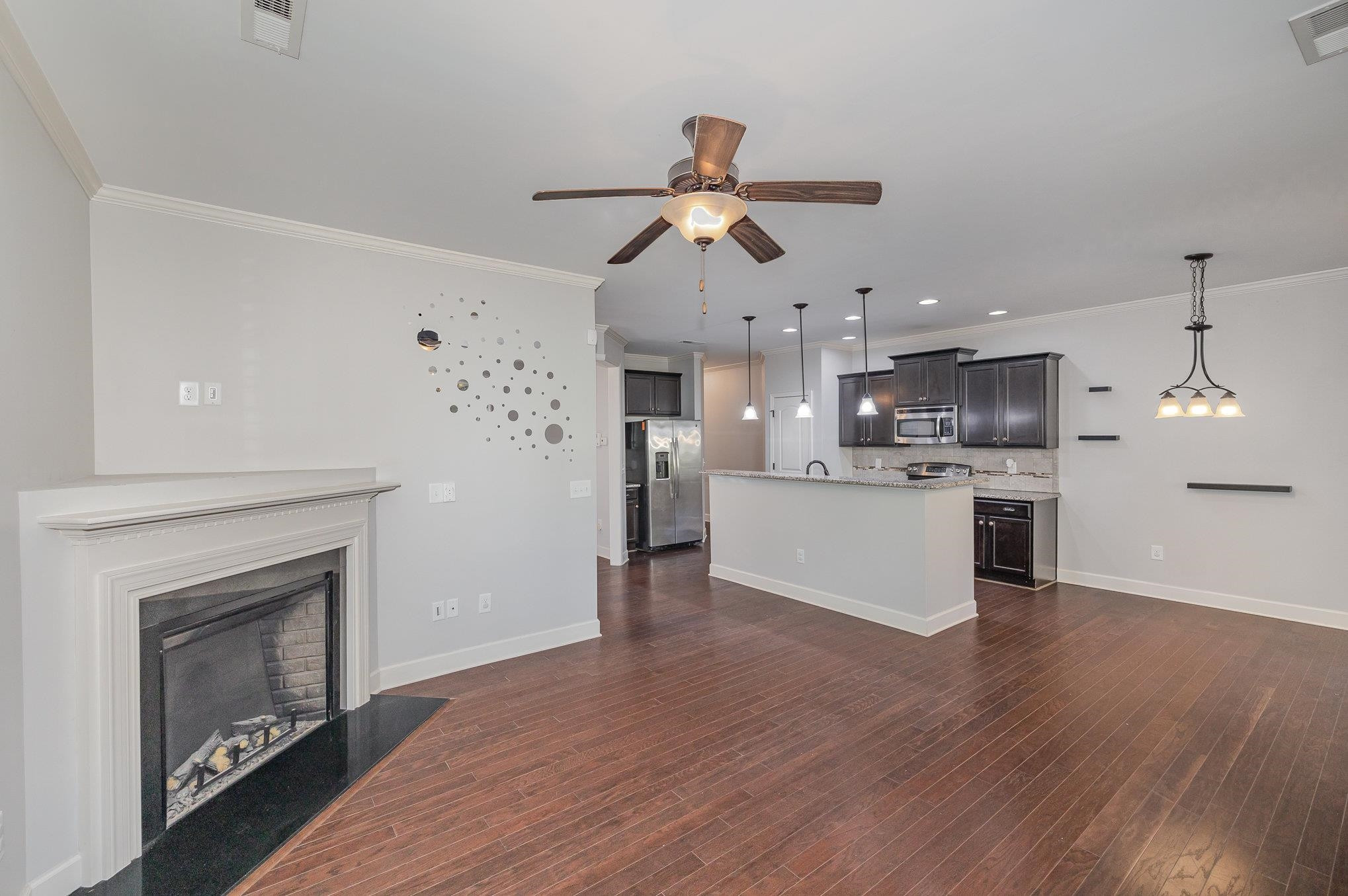 135 Pine Hawk Drive Spring Lake, NC 28390 - Photo 6 of 41 a view of kitchen with cabinets and wooden floor