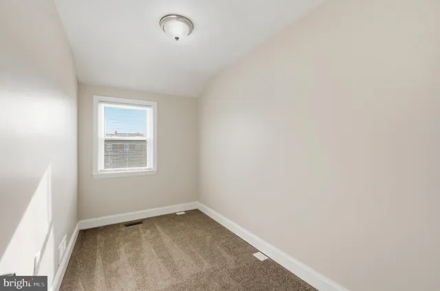 a view of a room that has a window in it