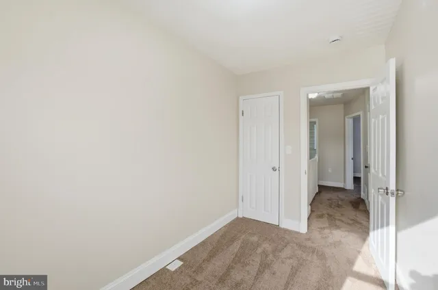 a view of hallway with closet