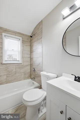 a bathroom with a sink a toilet and a bathtub