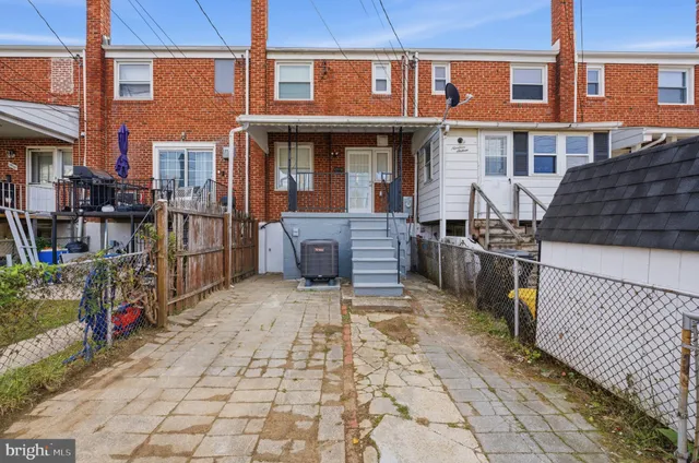 a view of a brick building with many windows
