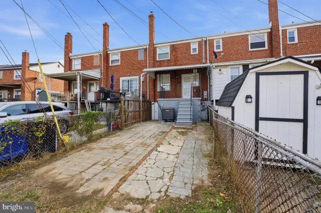 a view of a brick building with many windows