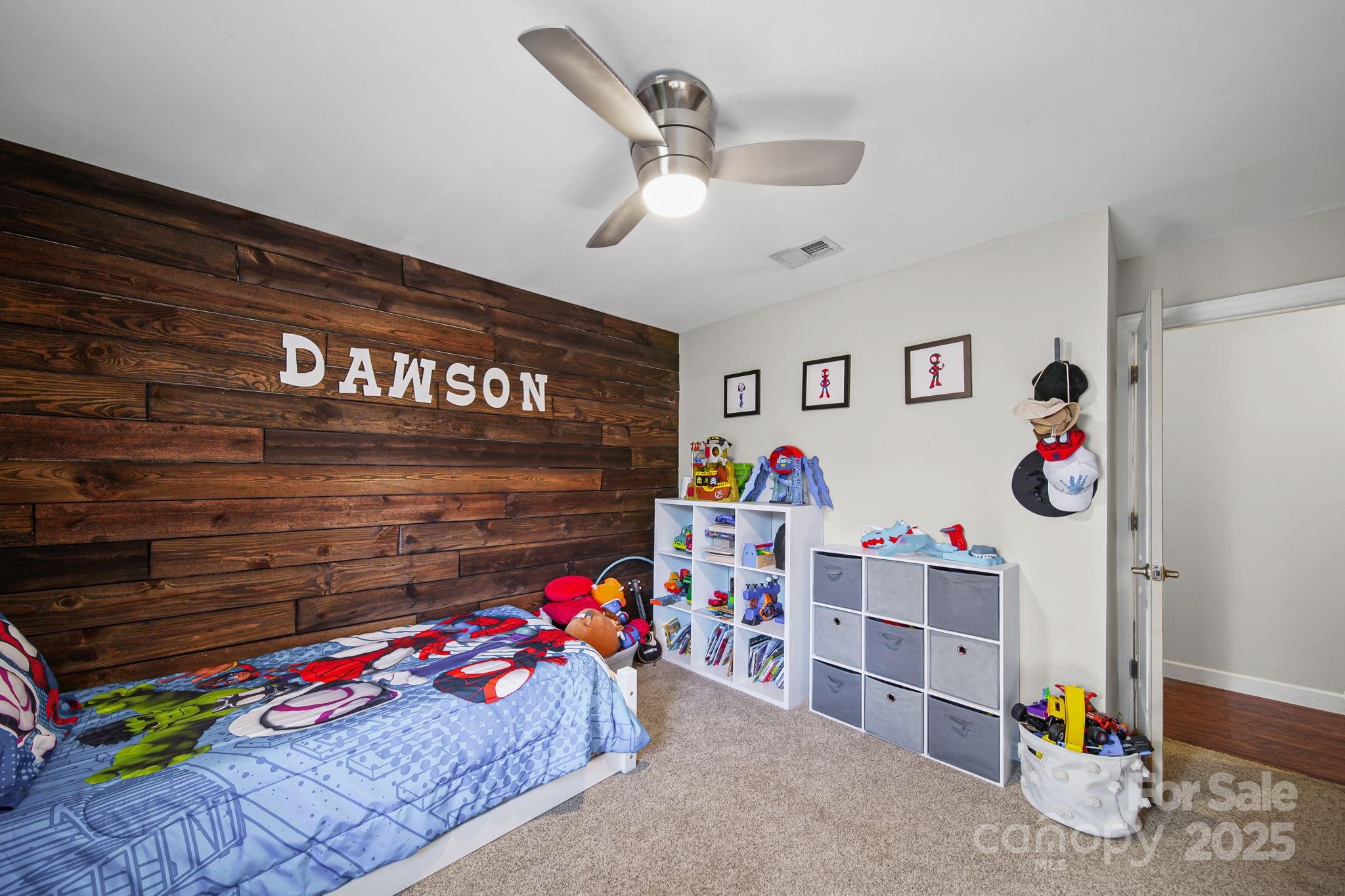 9116 Brief Road Mint Hill, NC 28227 - Photo 12 of 24 a bedroom with furniture and a chandelier