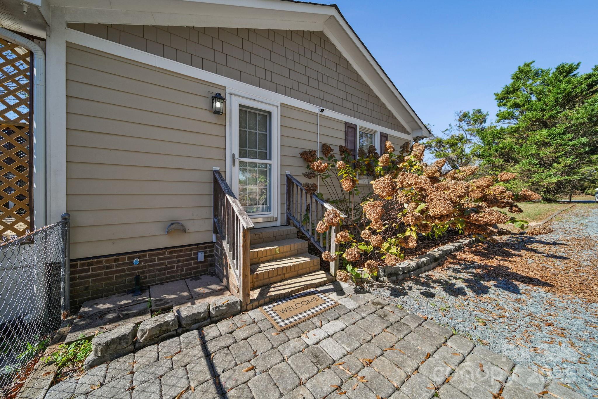 9116 Brief Road Mint Hill, NC 28227 - Photo 18 of 24 a house with trees in front of it