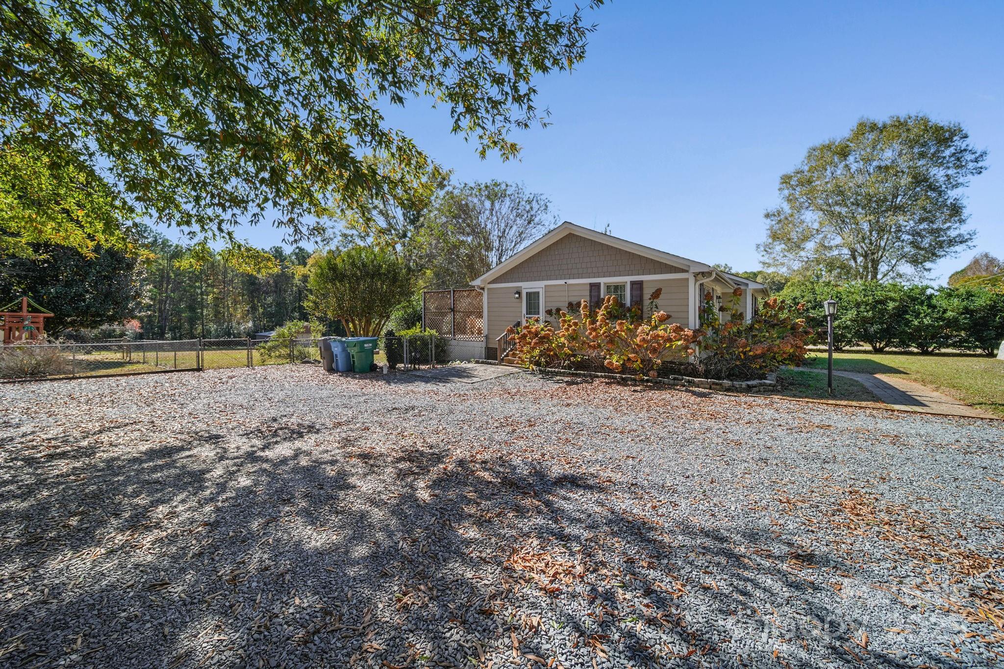 9116 Brief Road Mint Hill, NC 28227 - Photo 19 of 24 a view of outdoor space with deck and trees