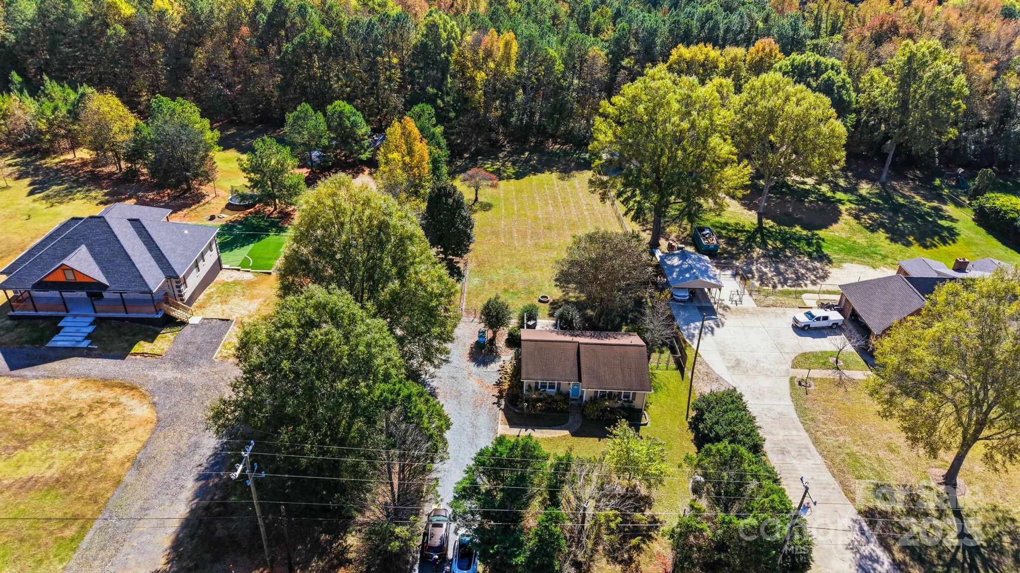 9116 Brief Road Mint Hill, NC 28227 - Photo 22 of 24 an aerial view of a house with swimming pool and garden