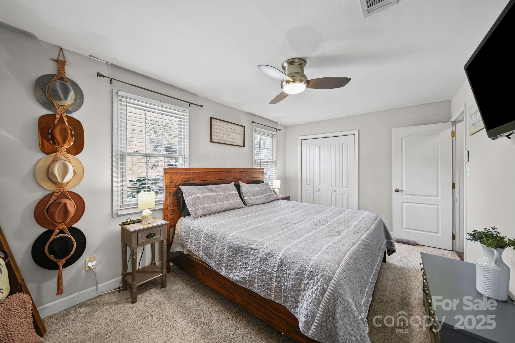 9116 Brief Road Mint Hill, NC 28227 - Photo 9 of 24 a bedroom with a bed and cabinets
