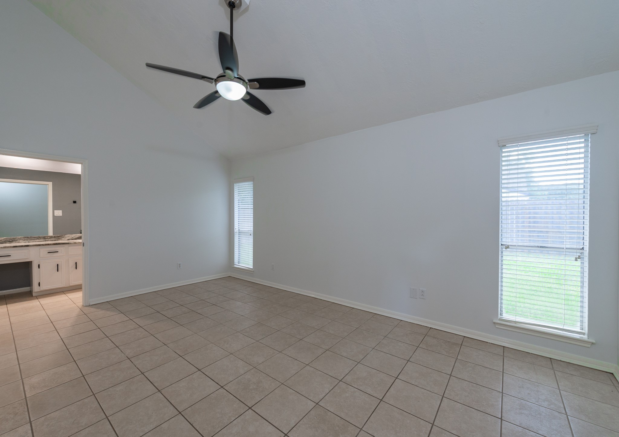 1022 White Sands Road Katy, TX 77450 - Photo 14 of 27 Primary bedroom with vaulted ceilings.