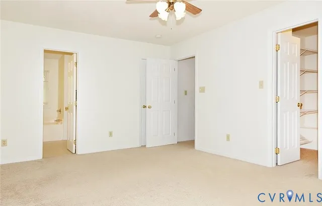 a living room with furniture a fireplace and a large window