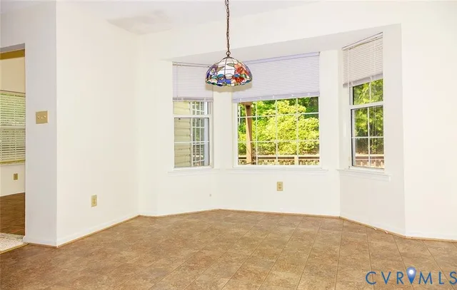 a view of deck with two chairs and wooden floor