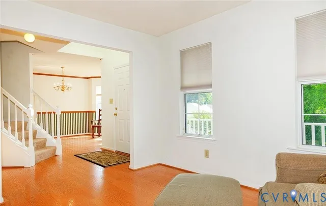a blue and white sitting area with a chair