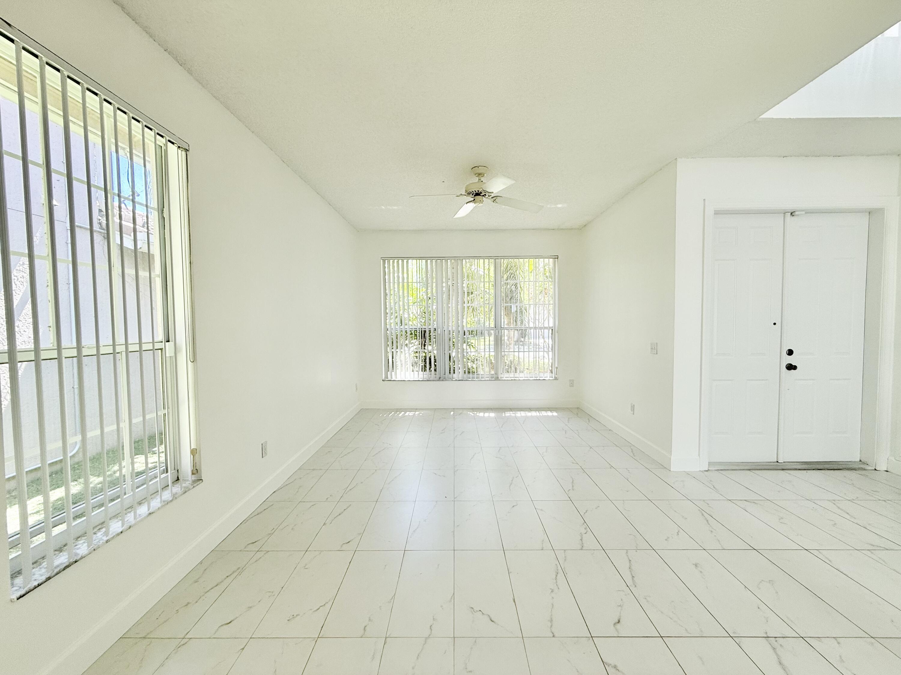 10875 Old Bridgeport Lane Boca Raton, FL 33498 - Photo 18 of 39 FORMAL LIVING ROOM AND FOYER